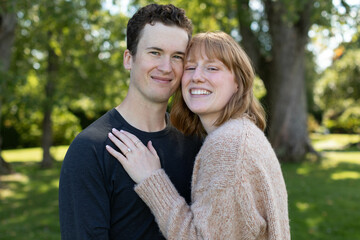 An engagement portrait of a lovely couple with a beautiful background.