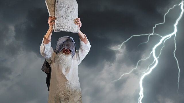 The Old Testament biblical prophet Moses holds the tablets with the ten  commandments