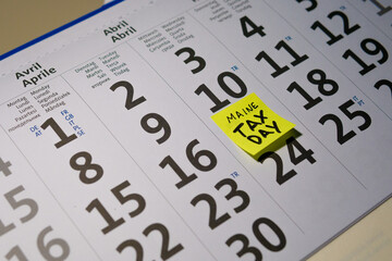 Calendar pointing at April 17th 2024, Tax Day in Maine, the USA for 2023 earnings. High quality photo