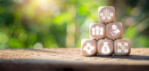 Fundraising concept, Wooden block on desk with fundraising icon on virtual screen.