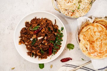 Kerala beef fry roast served with parotta and ghee rice - Malabar Iftar feast