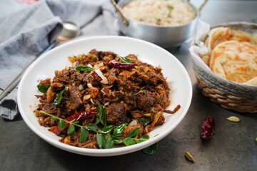 Kerala beef fry roast served with parotta and ghee rice - Malabar Iftar feast