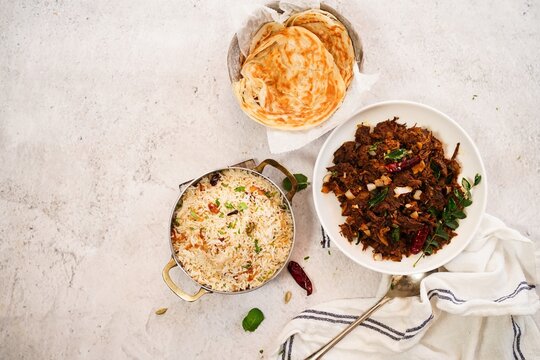 Kerala beef fry roast served with parotta and ghee rice - Malabar Iftar feast