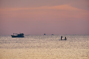 Fishing boat at sea in the evening at sunset on Phu Quoc Island of Vietnam.