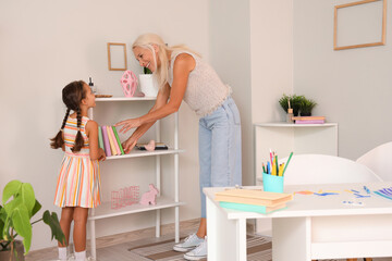 Little girl with her grandmother at home