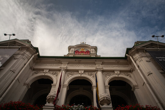 RIGA, LATVIA - AUGUST 21, 2023: Main facace of the Latvian National Theatre of Riga with its coat of arms. Called Latvias Nacionalais Teatris, it's a cultural venue of Latvia.