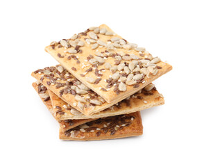Stack of cereal crackers with flax, sunflower and sesame seeds isolated on white