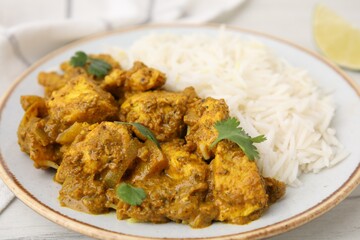 Delicious chicken curry with rice on table, closeup