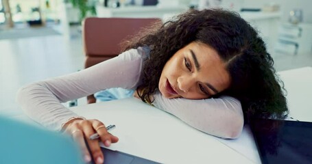 Laptop, bored and tired with business woman lying on desk in office with fatigue or exhaustion from work. Computer, burnout or depression and frustrated, unhappy or moody young employee in workplace