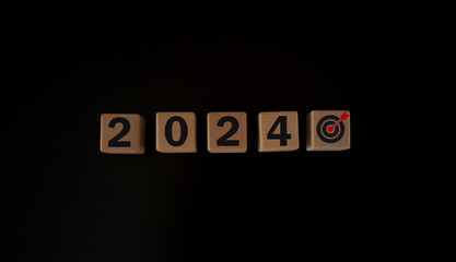 Fototapeta na wymiar Business goal, plan, action in 2024. wooden cubes with icon business strategies, action plan, goal, process, game plan, Business strategies and achieving goals, Business challenge, wooden cube.