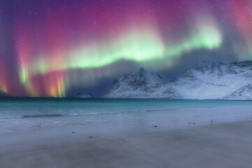 norway lofoten beach and red houses with night northern lights aurora borealis