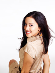 Young Hispanic Woman In Brown Dress Looking Back Over Shoulder