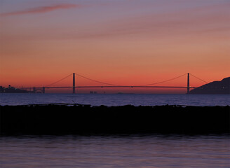Sunset Shot Of Golden Gate Bridge Seen From Berkeley