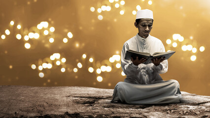 Muslim man sitting and reading the koran