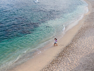 Couple in love by the sea, in zihuatanejo mexico