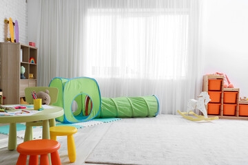 Interior of playroom with toys in kindergarten
