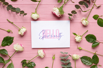 Greeting card with text HELLO SPRING, beautiful roses and eucalyptus on pink wooden background