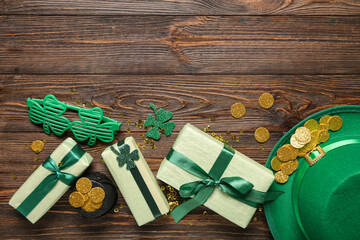 Gift boxes with leprechaun hat, pot of golden coins and plastic eyeglasses for St. Patrick's Day...