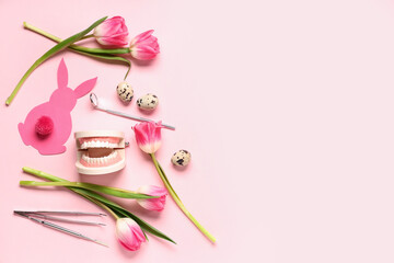 Composition with dentist's tools, tulip flowers and Easter decor on pink background