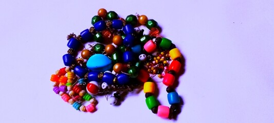 Colorful beads on white background 