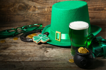 Glass of green beer with clover leaves, Leprechaun's hat, present, horseshoe and pot full of coins...