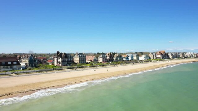 The large sandy beach of Sword beach in Europe, in France, in Normandy, towards Caen, in Ouistreham, in spring, on a sunny day.