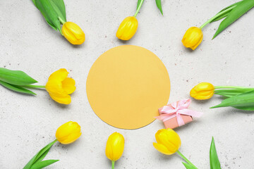 Composition with blank card, beautiful tulips and present on light background