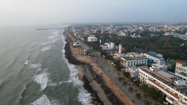 Early morning aerial footage of Pondycherry Beach, one of the oldest French colonies. When foreign tourists are on vacation, the promenade is typically one of their top destinations. Rocks beach