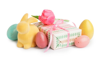 Easter bunny, painted eggs, tulip and gift on white background