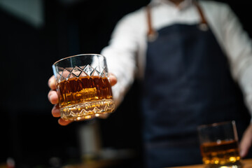 Barman pouring whiskey whiskey glass beautiful night