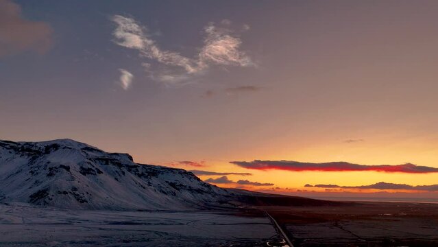 Nacreous Polar Clouds In The Orange Sky At Sunrise In South Iceland. - aerial shot