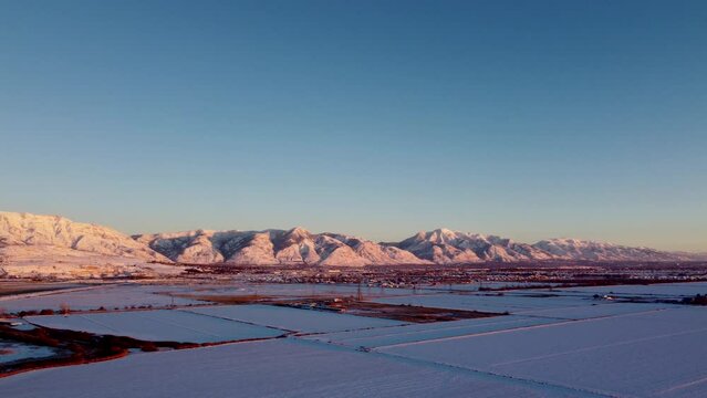 4k Aerial Drone Snow-Capped Mountains Overlooking Willard Bay, Utah