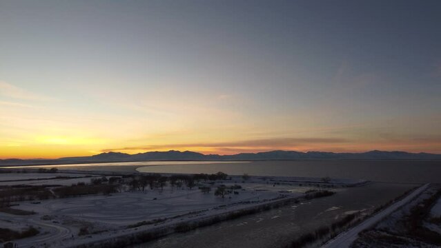 4k Aerial Drone Snow-Capped Mountains Overlooking Willard Bay, Utah