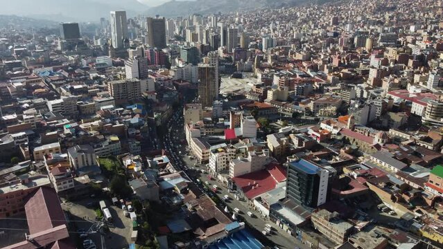 City traffic on street in urban cityscape, aerial over Oruro, Bolivia