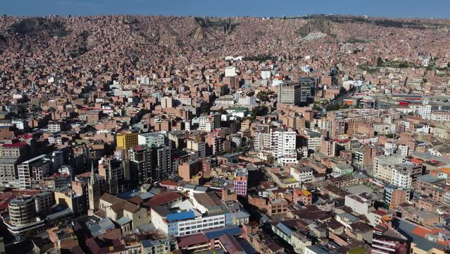 Aerial: Modern city of Oruro in a shallow bowl in Bolivian mountains