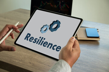 Resilience business and A Standard Quality resilience in organization  young man working on his laptop
