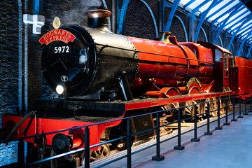Naklejka premium JAPAN - NOV 13, 2023: Hogwarts Railways history, a meticulously restored vintage steam locomotive stands proudly on display in Warner Bros. Studio Tour Tokyo Japan, The Making of Harry Potter