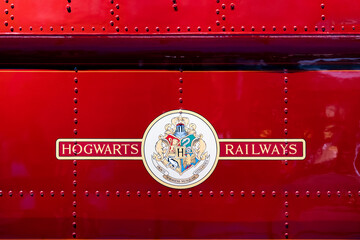 Fototapeta premium JAPAN - NOV 13, 2023: Hogwarts Railways logo on red train side destination to magical school in Warner Bros. Studio Tour Tokyo Japan, The Making of Harry Potter