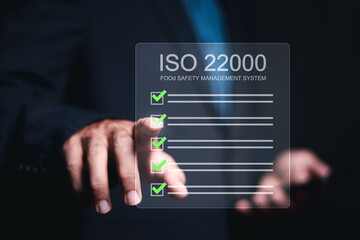 ISO 22000 Food standard assurance control certification. Businessman touching to food safety...