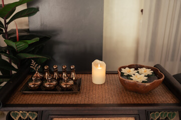 Essential Aromatic oil and candle on trey wooden for aromatherapy.