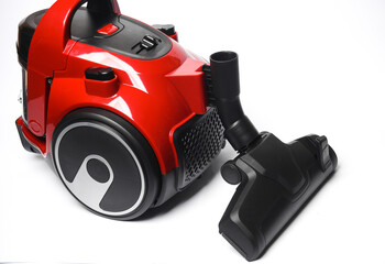 Fototapeta premium Red modern vacuum cleaner on a white background