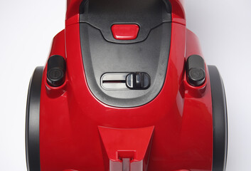 Red vacuum cleaner with buttons close-up