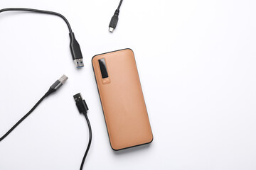 External battery power bank with many cables on a white background