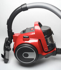 Modern vacuum cleaner floating on a white background