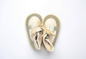 Children's used shoes on a white background