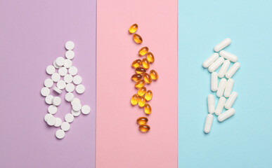 Different Pills on colored background. Medicine concept. Top view