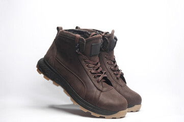 Pair of Brown leather boots on white background