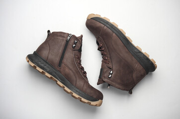 Pair of Brown leather boots on white background. Top view