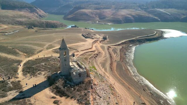 Swamp church Sau swamp dike in Catalonia, Spain, intense drought in 2024 pantano de Sau