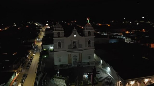 Saint Mary of Guadalupe's night aerial, capturing the illuminated facade and grand entry in Tecalitlan
